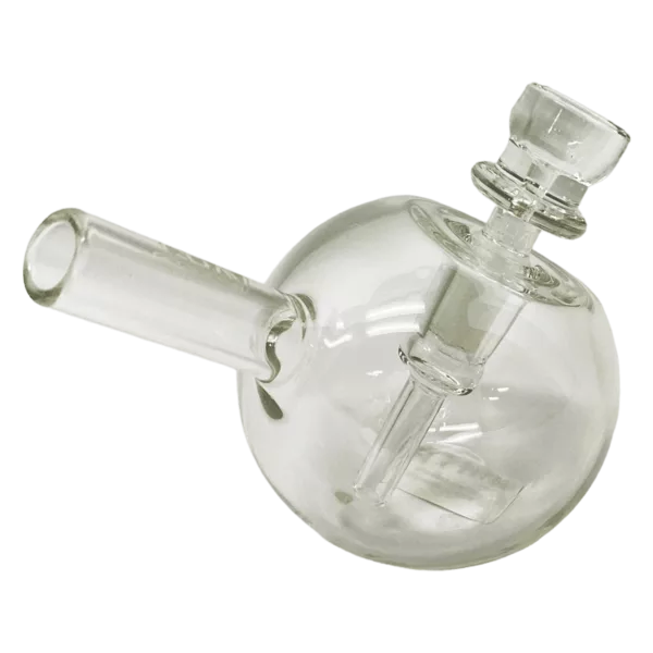 Clear glass water pipe with small circular handle and base. Spherical shape and sits on green background.