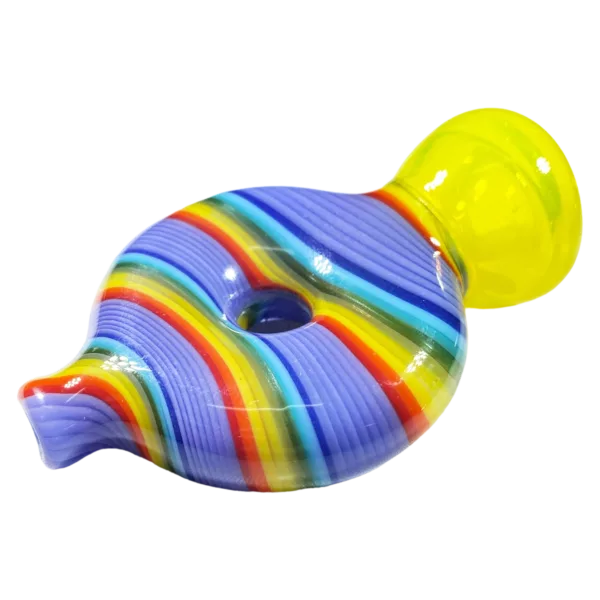A colorful, striped glass pipe in the shape of a donut, with a round base and curved neck. It is sitting on a white surface.