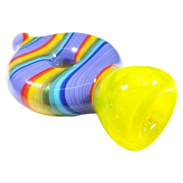 Colorful glass pipe or bong with rainbow pattern and yellow handle, sitting on white background.