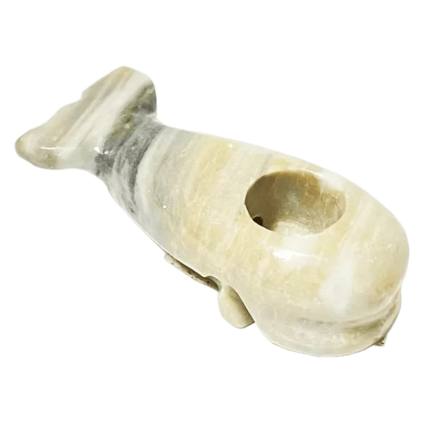 White and yellow whale-shaped object with small opening, Mystic Stone.
