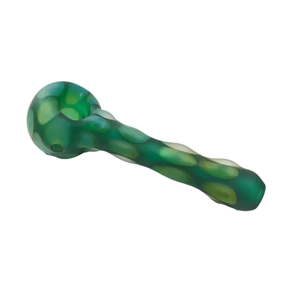 A green and white marble glass pipe with a small round hole, made by Casey Hadley and sold as TC5463. It has a smooth surface and sits on a green background.