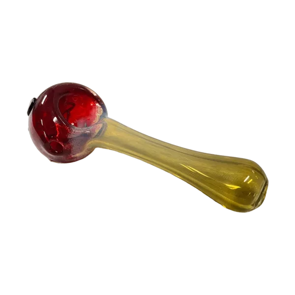 Stitch Frit Face bong by Casey Hadley - TC6212 features a clear glass body with a red, brown, and yellow swirl pattern on the base and stem, a light yellow bowl and base, and a clear stem with a yellow swirl pattern. The mouthpiece also has a yellow swirl pattern.