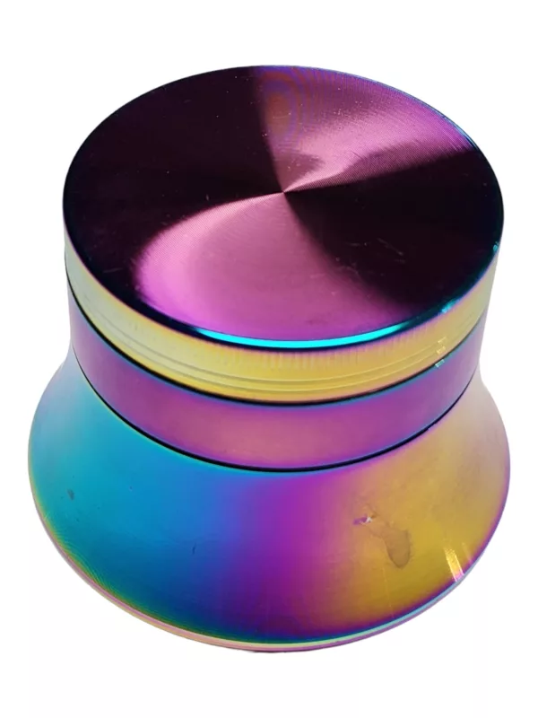 metallic, rainbow-colored grinder with a circular base and small opening, sitting on a white surface.