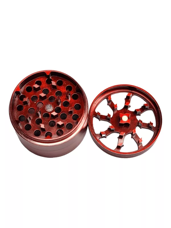Red circular metal grinder with multiple holes. Unknown purpose. Side Window Colored Grinder - BVGS07155.