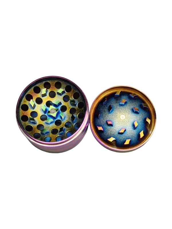 Handcrafted concave grinder with intricate blue, green, and yellow designs on a metallic finish. Small circular shape with a rainbow design on the surface.
