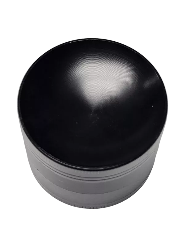 A black, round grinder with a smooth concave surface, flat base, and curved rim. No attachments or additional features.