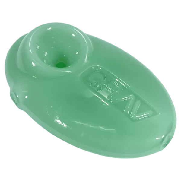 A bright green plastic spoon with a flat base and curved handle, made of flexible material. Branded Grav 1 and designed to be a conversation piece.
