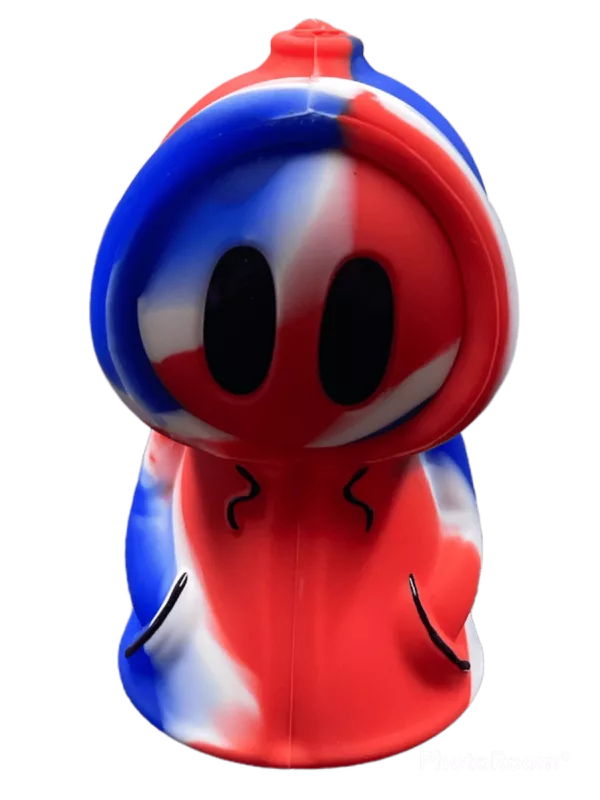 Silicone ghost sculpture with British flag design, white background, red, blue, and white stripes, and black eyes on a black background with white eyes and a nose.