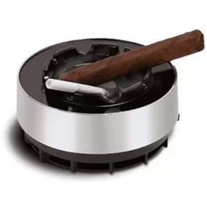 Stylish smokeless ashtray with large circular base and smaller round bowl on top. Bowl has raised rim and small hole for ashes. Open top and three legs for stability.
