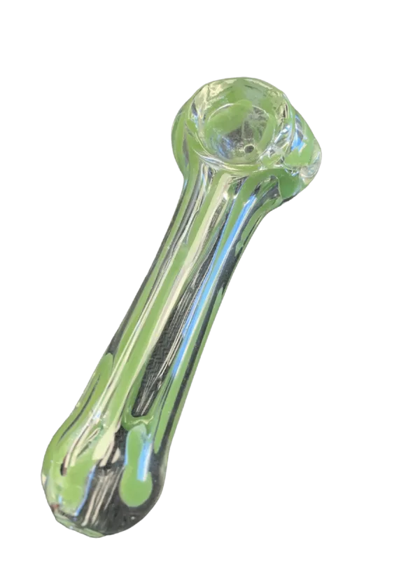 A clear glass spoon pipe with a long, curved stem and small, round bowl made of glass. The pipe is sitting on a green background.