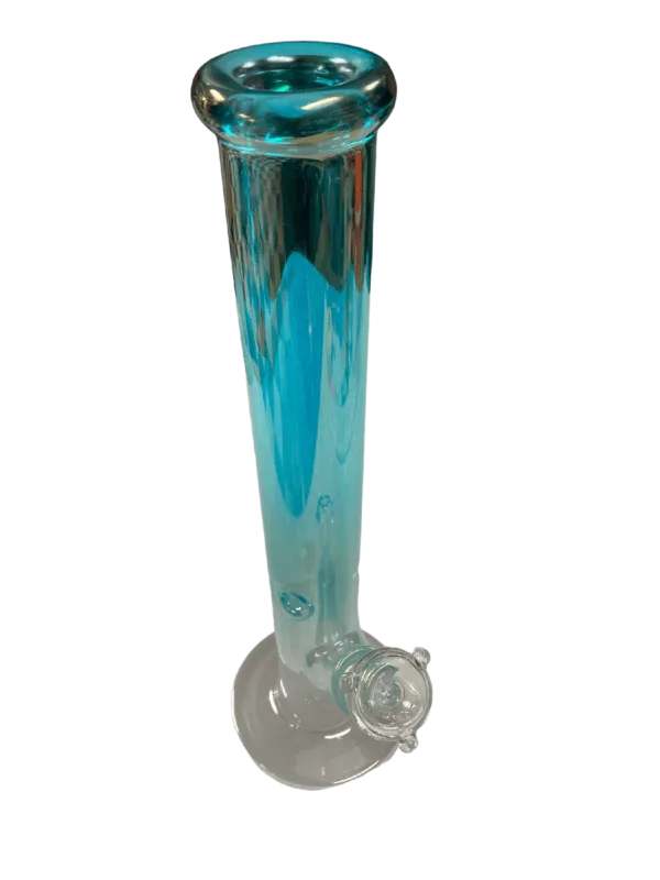 Blue glass bong with wooden base and metal stem. Round base, tapered neck, grooved pattern on base and small ring on stem. Stands on white cloth-covered table against dark grey background.