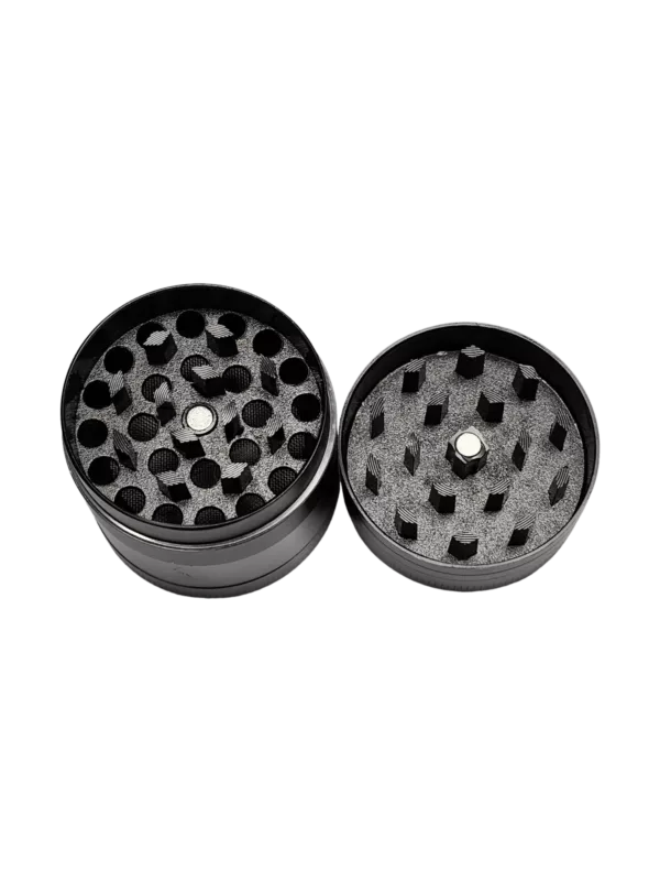 Black plastic herb grinder with holes and a matching lid.