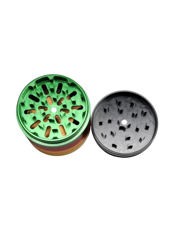 This circular grinder has a small hole in the center and is made of plastic with a black base and green top. It is designed to grind herbs and materials into a fine powder, commonly used for cannabis preparation.