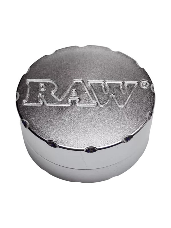Stainless steel Raw Grinder with smooth surface and flat top for grinding and rolling tobacco leaves.