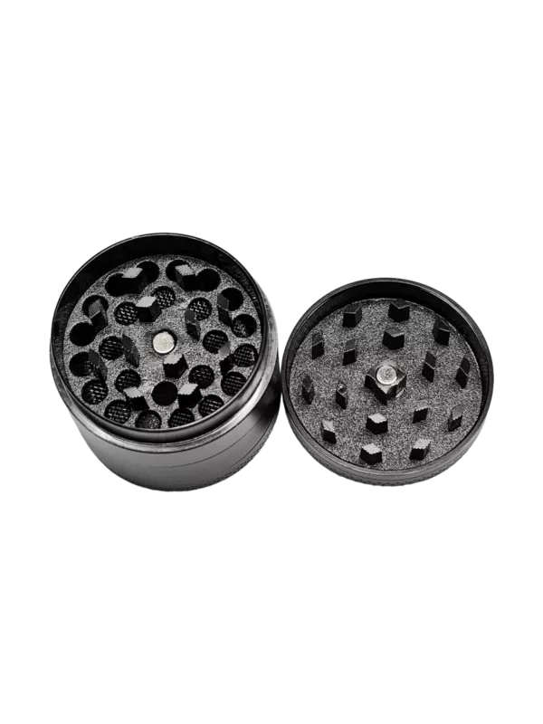 Black metal grinder with circular shape and small hole for grinding herbs and materials. Designed for use with grinder attachment for bong or other smoking device.