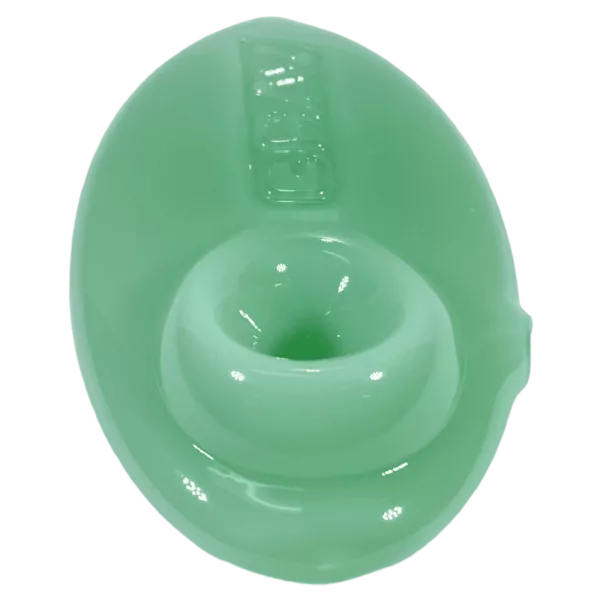 Smooth green plastic spoon with small, round handle and white tip. Perfect for stirring and measuring ingredients.